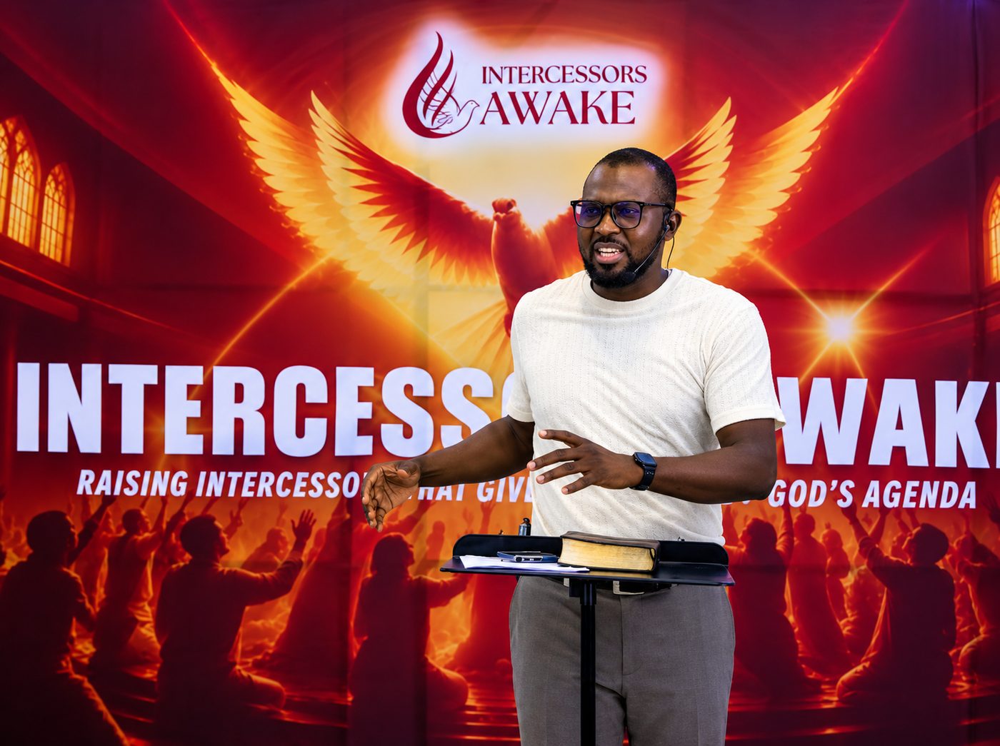 Tochi Ifejianyi teaching with the Bible on the lectern